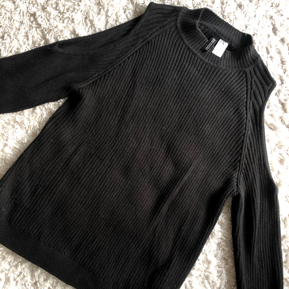 Black sweater with shoulder cutouts